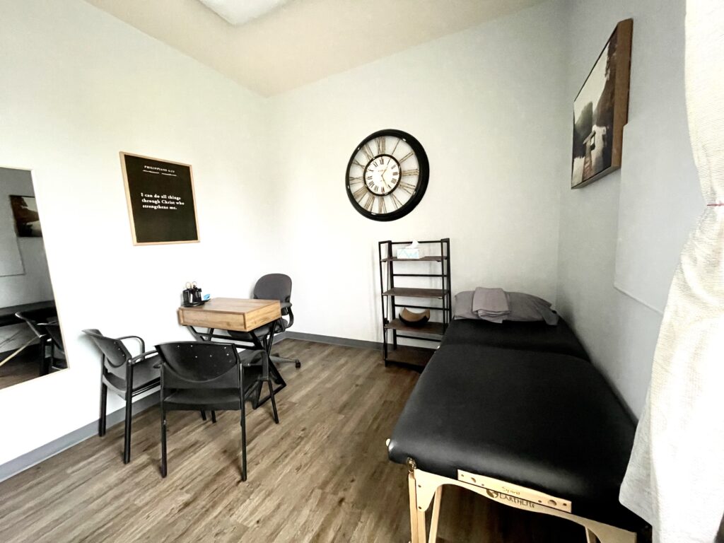 functional health room with chairs and a desk at Steadfast Spine and Sport in Warrenton MO